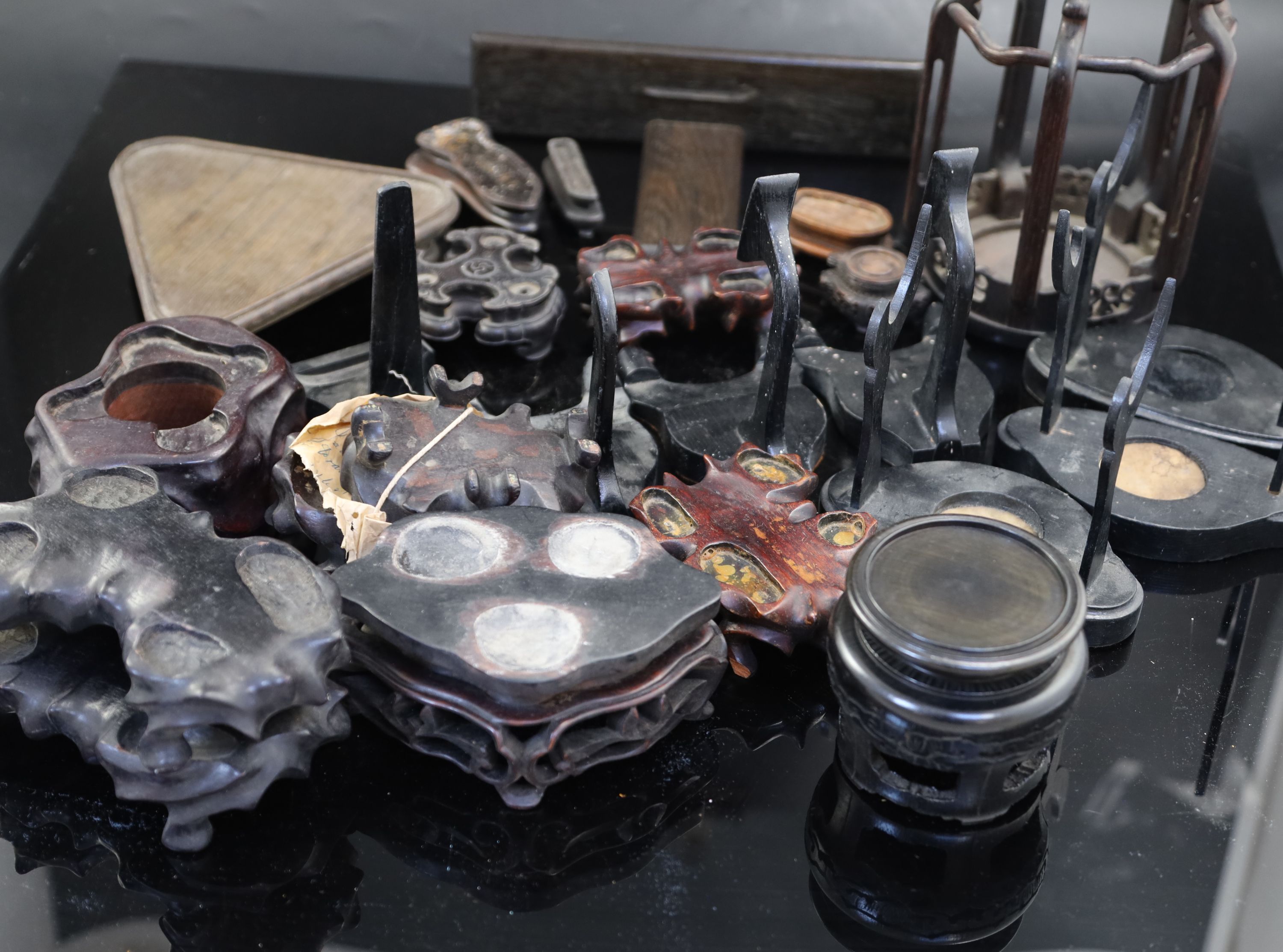 A collection of assorted Chinese hardwood vase stands